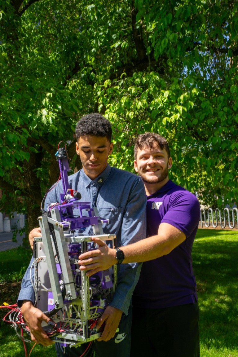 Two members of husky robotics.