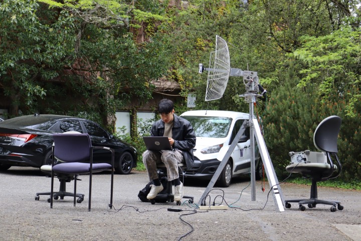 A student sitting with their computer.